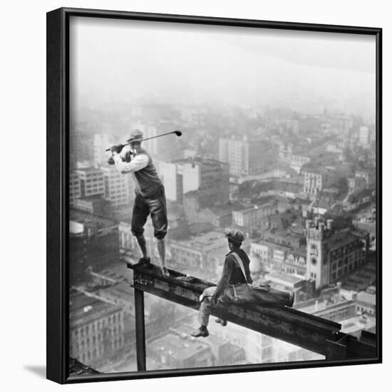 Golfer Teeing off on Girder High above City-null-Framed Photographic Print