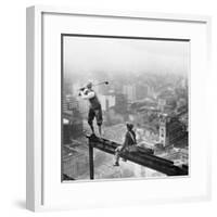 Golfer Teeing off on Girder High above City-null-Framed Photographic Print