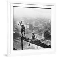 Golfer Teeing off on Girder High above City-null-Framed Photographic Print