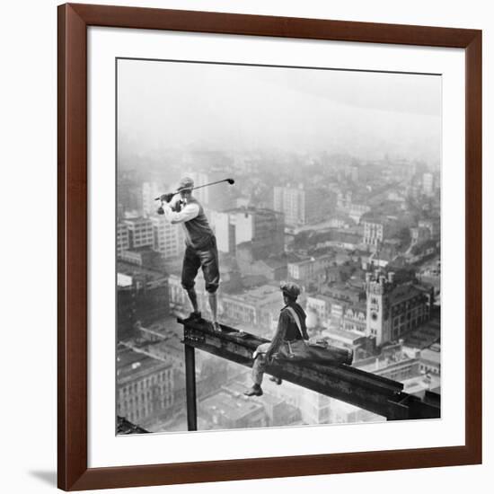 Golfer Teeing off on Girder High above City-null-Framed Photographic Print