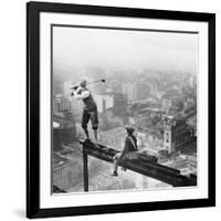 Golfer Teeing off on Girder High above City-null-Framed Photographic Print