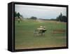 Golfers Sitting on Bench Near Practice Greens While Awaiting Tee Time on Pinehurst Golf Course-Walker Evans-Framed Stretched Canvas