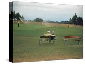 Golfers Sitting on Bench Near Practice Greens While Awaiting Tee Time on Pinehurst Golf Course-Walker Evans-Stretched Canvas