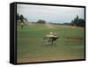 Golfers Sitting on Bench Near Practice Greens While Awaiting Tee Time on Pinehurst Golf Course-Walker Evans-Framed Stretched Canvas