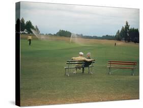 Golfers Sitting on Bench Near Practice Greens While Awaiting Tee Time on Pinehurst Golf Course-Walker Evans-Stretched Canvas