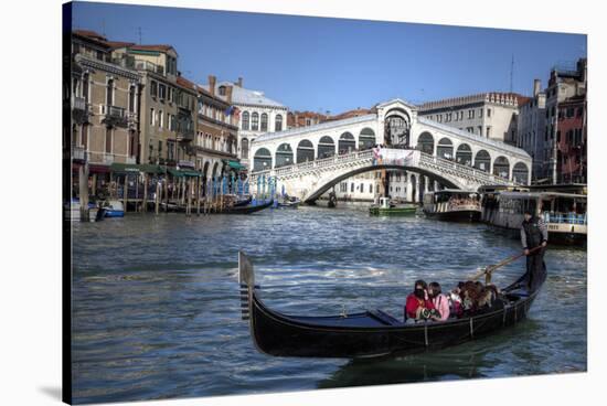 Gondola Grand Canal with Rialto Bridge in Background, Venice, Italy-Darrell Gulin-Stretched Canvas