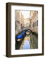 Gondola Parking under Bridge. Venice. Italy-Tom Norring-Framed Photographic Print