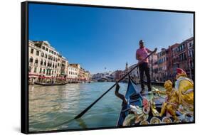 Gondolier paddling a gondola in Venice, Italy, Europe-Mark A Johnson-Framed Stretched Canvas