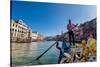 Gondolier paddling a gondola in Venice, Italy, Europe-Mark A Johnson-Stretched Canvas