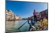 Gondolier paddling a gondola in Venice, Italy, Europe-Mark A Johnson-Mounted Photographic Print