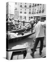 Gondoliers, Venice, Italy-Walter Bibikow-Stretched Canvas