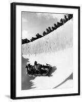 Good of Cresta Run, Bobsled Run, Coasting around Sunny Bend as People Peer from Above the Track-Alfred Eisenstaedt-Framed Premium Photographic Print