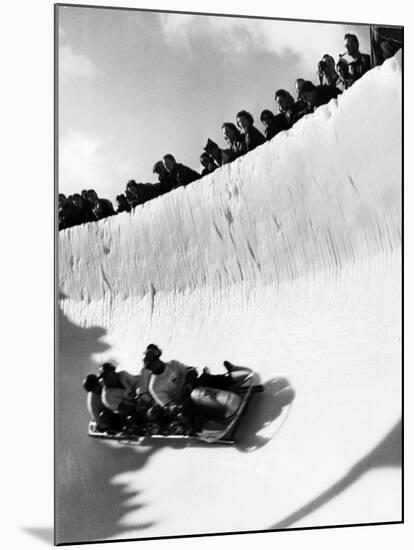 Good of Cresta Run, Bobsled Run, Coasting around Sunny Bend as People Peer from Above the Track-Alfred Eisenstaedt-Mounted Photographic Print