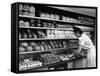 Good of Worker in Bakery Standing in Front of Shelves of Various Kinds of Breads and Rolls-Alfred Eisenstaedt-Framed Stretched Canvas