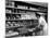 Good of Worker in Bakery Standing in Front of Shelves of Various Kinds of Breads and Rolls-Alfred Eisenstaedt-Mounted Photographic Print