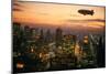 Goodyear Blimp Sails over Midtown Manhattan Skyline at Dusk, New York City. Blimps are No.. (Photo)-James L Stanfield-Mounted Giclee Print