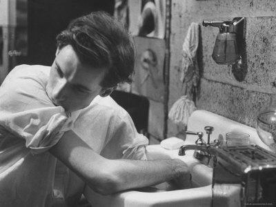Pianist Glenn Gould Soaking His Hands in Sink to Limber Up His Fingers Before in Studio