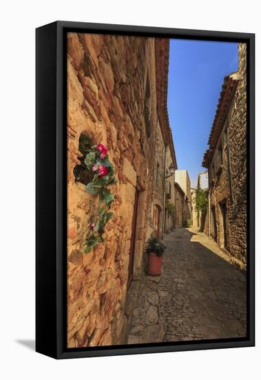 Gorgeous medieval village, cobblestone narrow lane and flowers, Peratallada, Baix Emporda, Girona,-Eleanor Scriven-Framed Stretched Canvas