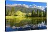 Gorgeous Reflection in the Smooth Water of the Lake in the Park.  Snowy Mountains and Evergreen For-kavram-Stretched Canvas