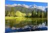 Gorgeous Reflection in the Smooth Water of the Lake in the Park.  Snowy Mountains and Evergreen For-kavram-Mounted Photographic Print