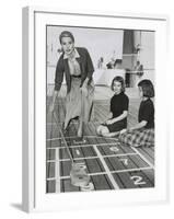 Grace Kelly by Playing Shuffleboard on the Deck of the Uss Constitution, April 10, 1956-null-Framed Photo