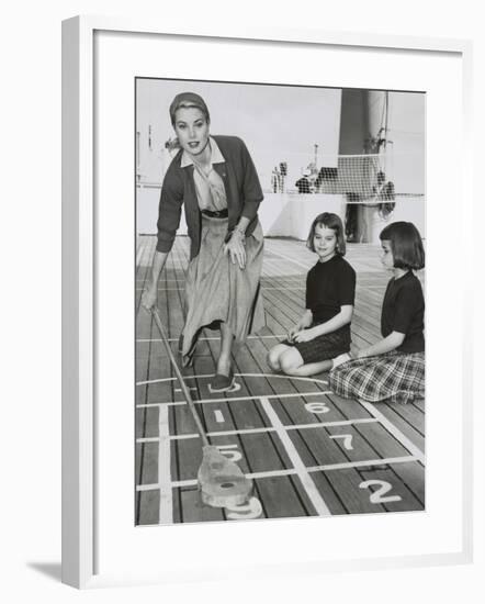 Grace Kelly by Playing Shuffleboard on the Deck of the Uss Constitution, April 10, 1956-null-Framed Photo