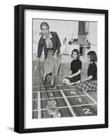 Grace Kelly by Playing Shuffleboard on the Deck of the Uss Constitution, April 10, 1956-null-Framed Photo