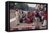 Graham Hill Watches Mechanics Working on a Car, French Grand Prix, Rouen, 1968-null-Framed Stretched Canvas