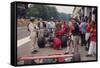 Graham Hill Watches Mechanics Working on a Car, French Grand Prix, Rouen, 1968-null-Framed Stretched Canvas