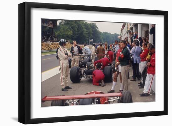 Graham Hill Watches Mechanics Working on a Car, French Grand Prix, Rouen, 1968-null-Framed Photographic Print