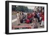 Graham Hill Watches Mechanics Working on a Car, French Grand Prix, Rouen, 1968-null-Framed Photographic Print