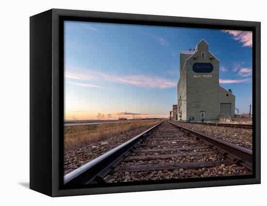 Grain elevator and railroad track, Milk River, Alberta, Canada-null-Framed Stretched Canvas