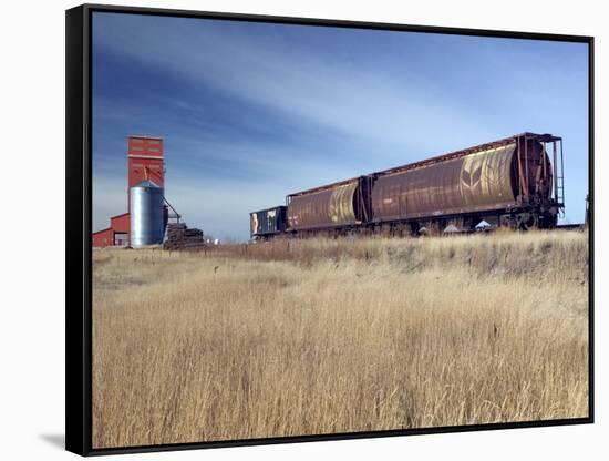 Grain Elevators and Wheat Train, Saskatchewan, Canada-Walter Bibikow-Framed Stretched Canvas