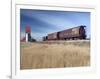 Grain Elevators and Wheat Train, Saskatchewan, Canada-Walter Bibikow-Framed Photographic Print