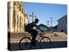 Granada, Man Riding Bike Past Iglesia De La Merced, Nicaragua-Jane Sweeney-Stretched Canvas
