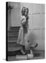 Grand Daughter of Winston Churchill, Arabella Spencer Churchill, Jouncing on Bathroom Scale-Carl Mydans-Stretched Canvas