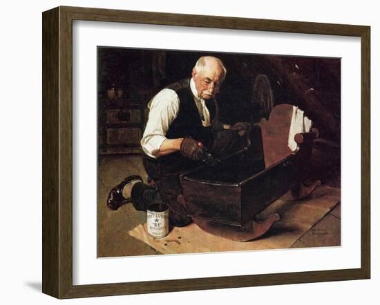 Grandpa’s Gift (or Grandfather Varnishing the Cradle; Up in the Garret)-Norman Rockwell-Framed Giclee Print