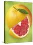 Grapefruit and Wedge of Grapefruit with Pink Flesh-null-Stretched Canvas