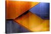 Graphic Composition of Orange Stairs Against a Blue Wall-Rona Schwarz-Stretched Canvas