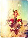 A Pretty Woman Sitting in a Swing-graphicphoto-Photographic Print