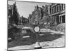 Grass Growing Out of Closed Hollmann Stasse Separates Ghostly Ruins of Once Handsome Buildings-Walter Sanders-Mounted Photographic Print