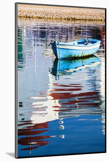 Greece, Mykonos, Hora, Fishing Boat and Reflection of a Church in the Water-Hollice Looney-Mounted Photographic Print