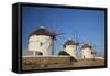 Greece, Mykonos. Windmills along the water-Hollice Looney-Framed Stretched Canvas