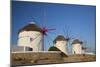 Greece, Mykonos. Windmills along the water-Hollice Looney-Mounted Photographic Print