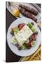 Greece, Peloponnese, Corinth, Greek Salad with Souvlaki and Fries-Walter Bibikow-Stretched Canvas