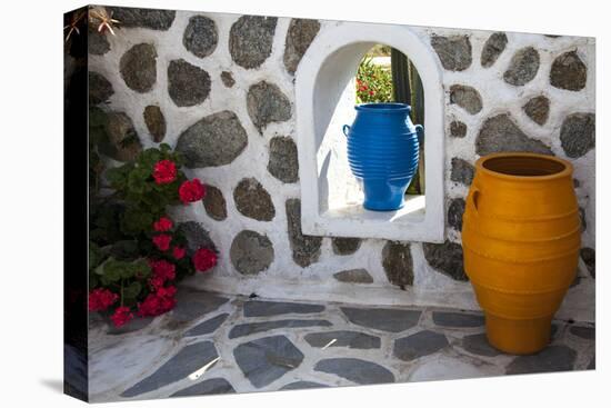 Greece, Santorini. Flower pots decorating a courtyard-Hollice Looney-Stretched Canvas