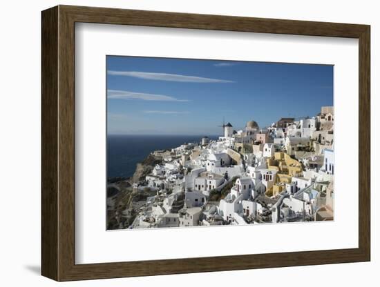 Greece, Santorini. The village of Oia glowing in the afternoon light.-Brenda Tharp-Framed Photographic Print