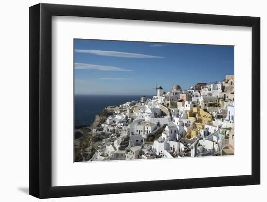 Greece, Santorini. The village of Oia glowing in the afternoon light.-Brenda Tharp-Framed Photographic Print