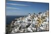 Greece, Santorini. The village of Oia glowing in the afternoon light.-Brenda Tharp-Mounted Photographic Print