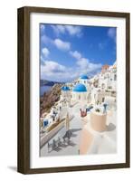 Greek Church with Three Blue Domes in the Village of Oia-Neale Clark-Framed Photographic Print